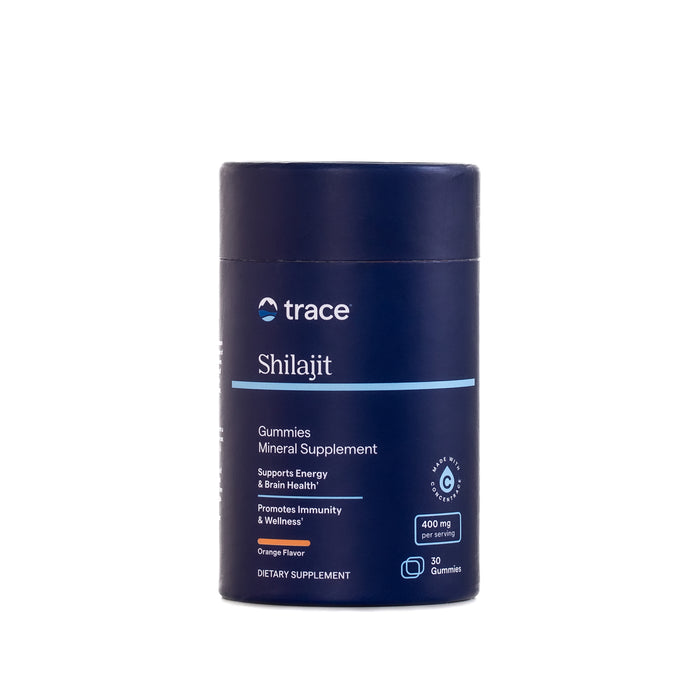 A dark blue cylindrical container of Trace Minerals Shilajit Gummies, an Ayurvedic-inspired supplement for energy, brain health, and immunity. The orange-flavored label notes 400 mg per serving of trace minerals and 30 gummies.