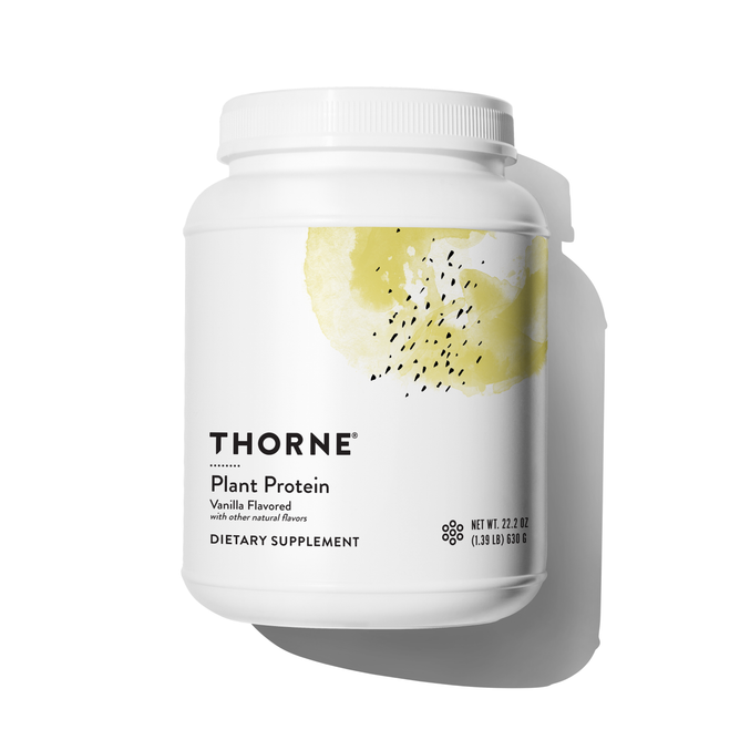 A white screw-top container of Thorne Plant Protein - Dairy Free, vanilla flavor, features a minimalist label with a yellow watercolor design. This vegan supplement provides a complete amino acid profile and casts a shadow to the right.