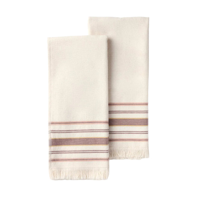 Two folded cream-colored Aptos Organic Hand Towels by Coyuchi, featuring fringed edges and horizontal brown, tan, and burgundy stripes near the ends, are displayed on a plain white background. This set includes two decorative kitchen towels.