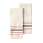 Two folded cream-colored Aptos Organic Hand Towels by Coyuchi, featuring fringed edges and horizontal brown, tan, and burgundy stripes near the ends, are displayed on a plain white background. This set includes two decorative kitchen towels.