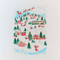 A festive scene with snowy village, decorated houses, Santa’s sleigh, candy canes, and eco-friendly wrapping features on Sarahs Silks Winter Wonderland Reusable Gift Wrap Furoshiki Set.
