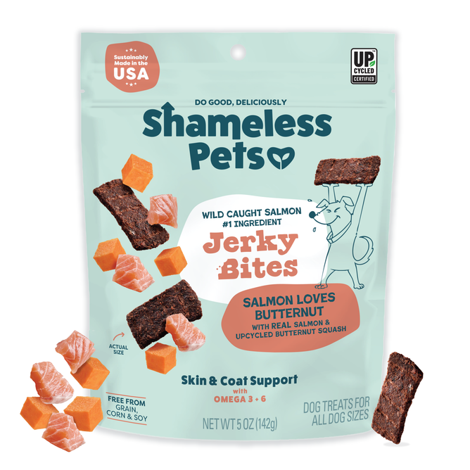 A bag of Shameless Pets Salmon Loves Butternut Jerky Dog Treats, made with wild-caught fish and butternut squash. The blue package shows salmon, squash cubes, and jerky pieces, highlighting omega-3s for skin and coat support.