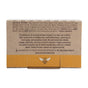 Back of a Savannah Bee Company product box displaying the ingredients list, an inspiring note on the vital role of bees, and the Savannah Bee logo featuring a bee against a yellow backdrop at the bottom. The Beeswax Lip Balm from the Bee The Balm Lip Balm Gift Set makes for a thoughtful gift for those who appreciate natural beauty products and support pollinator protection.