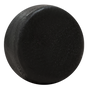 A close-up of a black hockey puck with a textured surface, set against white—its smooth finish evokes the feel after using Good Juju Body & Home’s Scalp Care Conditioner Bar.