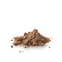 A small mound of Chagrin Valley Soap & Salve Dry Hair Shampoo: Dark Hair, light brown and slightly clumped, sits on a white surface with scattered crumbs around it.