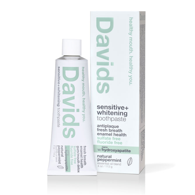 A tube and box of Davids Sensitive + Whitening w/nano-hydroxyapatite Toothpaste in natural peppermint, fluoride free, sulfate free, with hydroxyapatite for enamel health and whitening.