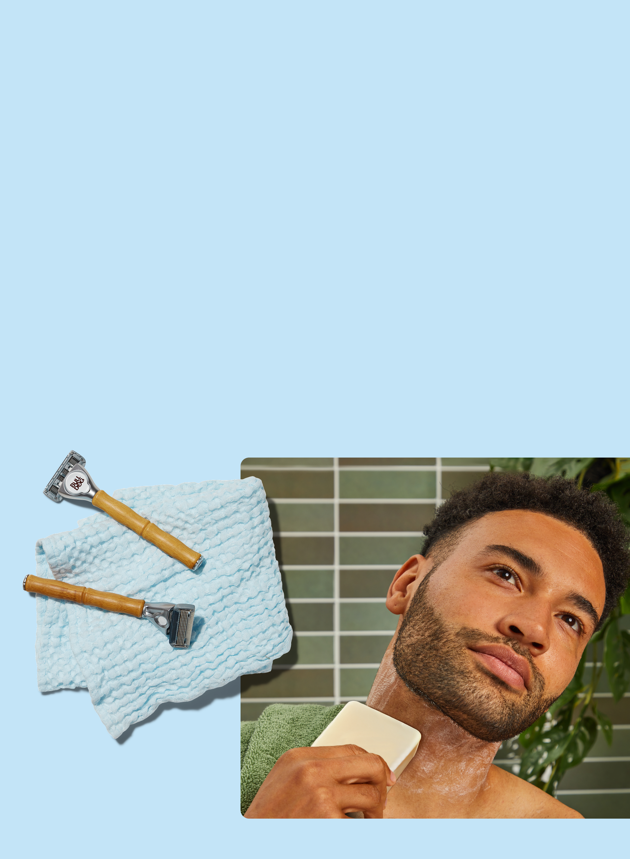 A man shaves his neck with a soap bar and safety razor. Nearby, two razors rest on a textured blue towel, all set against a light blue background.