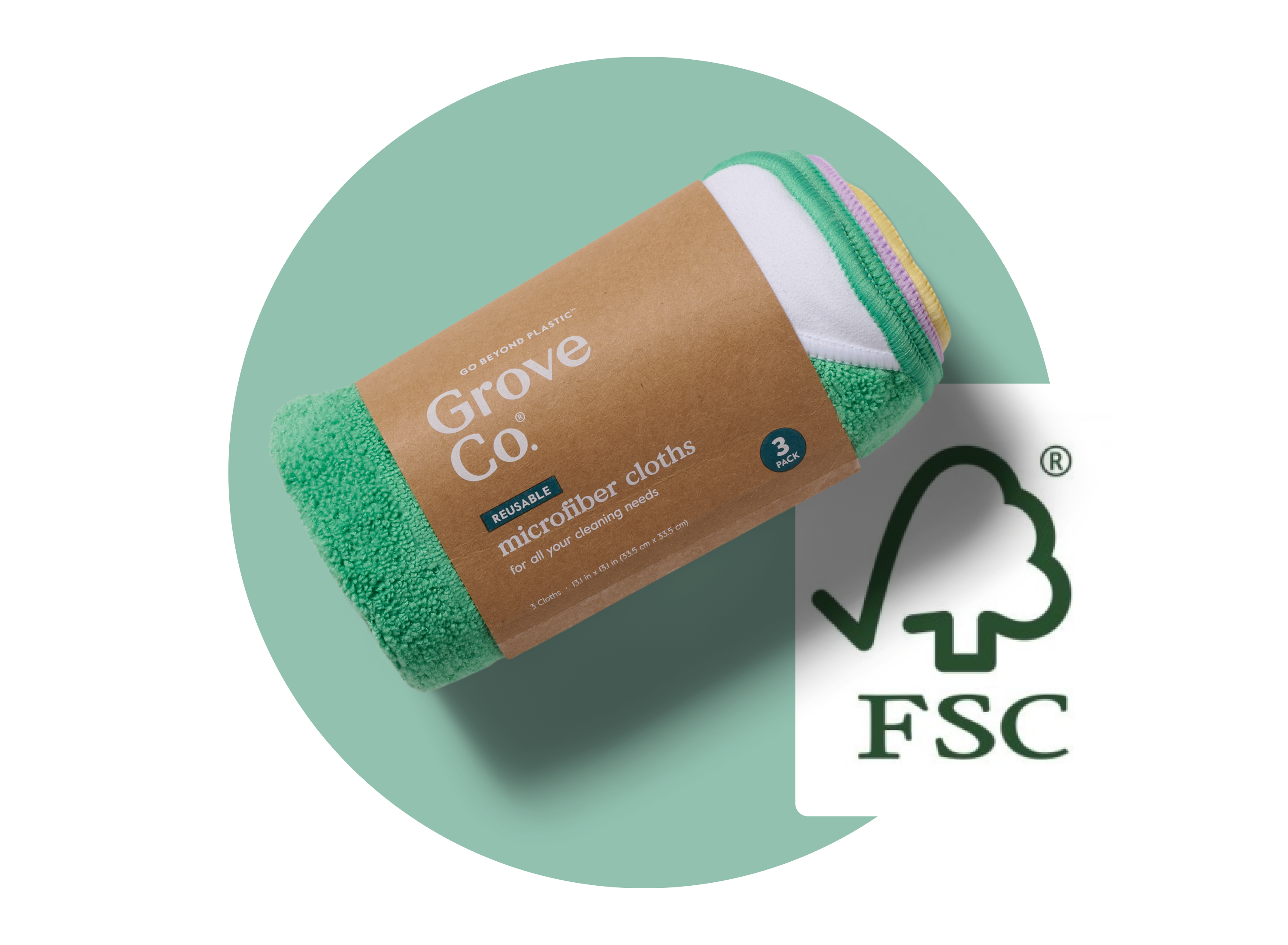 A rolled pack of Grove Co. reusable microfiber cloths with a brown label, placed on a green circle background next to the FSC certification logo.