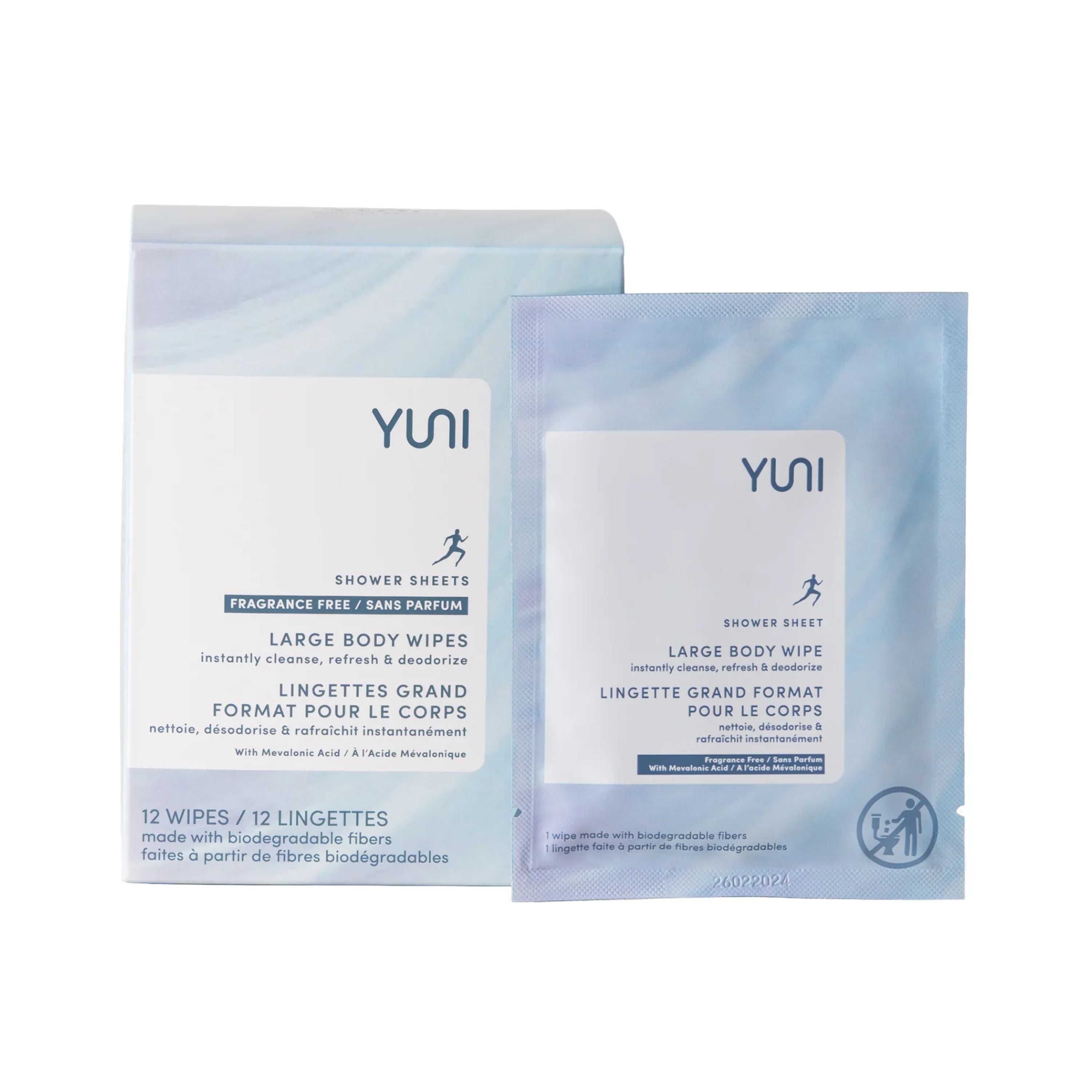 A box and a single packet of YUNI Shower Sheets, large body wipes, fragrance-free, with bilingual English and French text. The packaging is white with blue accents and contains 12 wipes made with biodegradable fibers.