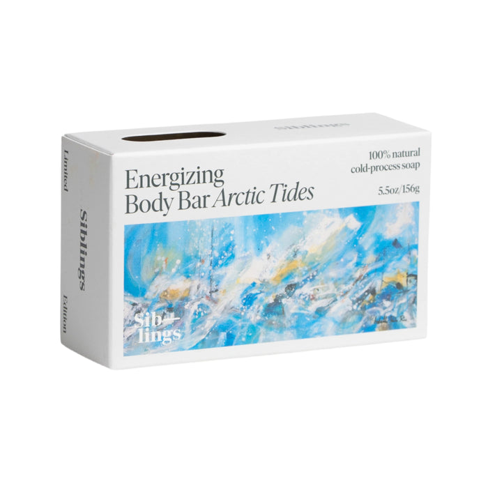 Siblings Energizing Body Bar in Arctic Tides scent features an abstract design in blue, white, and gold. This 5.5 oz/156 g cold-processed soap is 100% natural and infused with olive oil and sea kelp.