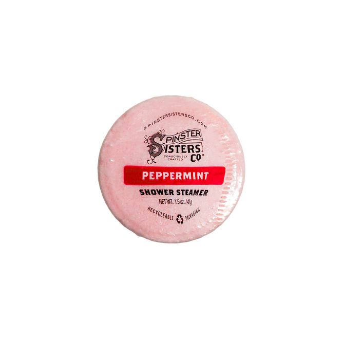 The Spinster Sisters Co. Peppermint Shower Steamer is a round, pink, 1.5-ounce vegan product with recyclable packaging and peppermint essential oil—perfect for a refreshing aromatherapy shower experience.
