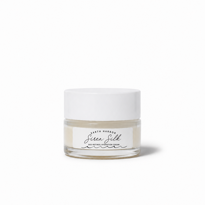 A sample-sized glass jar with a white lid labeled "Earth Harbor SIREN SILK Bio-Retinol Hydration Cream" sits against a plain white background.