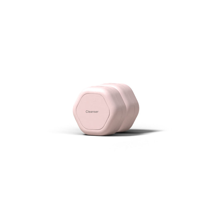 A light pink, hexagonal Cadence Skincare Duo Travel Container labeled Cleanser, shown on a white background.