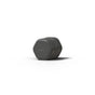 A dark gray, hexagonal Cleanser bar rests on a white surface with a shadow nearby—ideal for storing in your Cadence Skincare Duo Travel Containers or any TSA-approved travel case.
