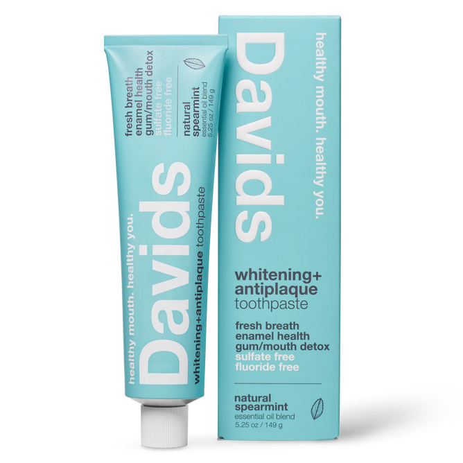A tube and box of Davids Premium Toothpaste - Whitening + Antiplaque in natural spearmint flavor, featuring a light blue design with white text highlighting benefits such as enamel health, detox, and fluoride-free. This EWG Verified toothpaste is a natural whitening formula, crafted as a fluoride free option for a cleaner, healthier smile.