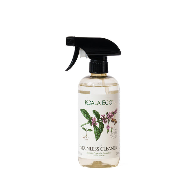 A clear spray bottle labeled Koala Eco Stainless Steel Cleaner with botanical illustrations and a black trigger nozzle, containing transparent liquid—an eco-friendly cleaner ideal for stainless steel surfaces.