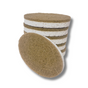A stack of Scrub Be Love Oval Dish Sponges (6-Pack) with one sponge leaning against the pile. The brown and white plant-based pads have a rough, fibrous, eco-friendly texture. The background is white.