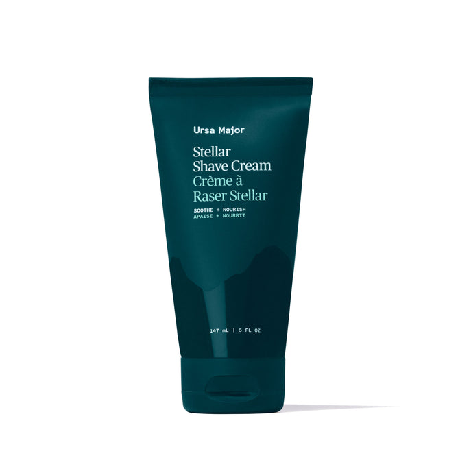 Ursa Major Stellar Shave Cream comes in a dark teal 5 fl oz (147 mL) tube with English and French text. This non-lathering cream has a natural botanical scent and is designed to soothe and nourish skin.