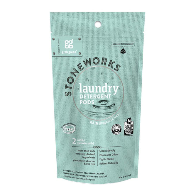 A package of grab greens Stoneworks Laundry Detergent Pods - Rain - Sample is displayed in teal, featuring eco-friendly labels and natural ingredients. EPA Safer Choice Certified, it includes 2 pods for deep cleaning and odor elimination.