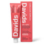 A tube and box of Davids Kids + Adults Premium Toothpaste in natural strawberry and watermelon flavor, featuring fluoride-free whitening and antiplaque benefits, and packaged in eye-catching pink for both kids and adults.