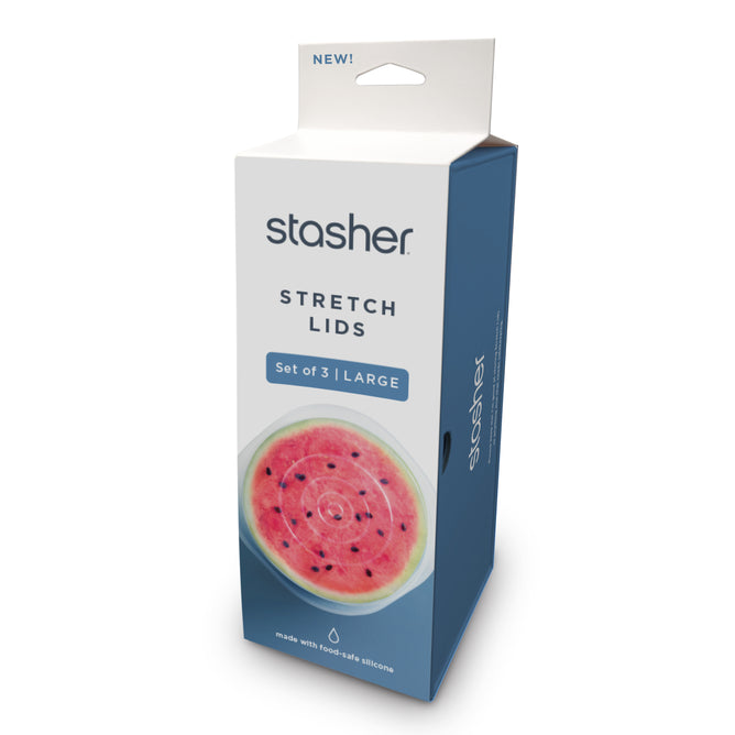 A blue and white box labeled Stasher Reusable Stretch Lids 3-pack Large features a watermelon half covered by silicone lids. The upright packaging has a top handle for easy carrying.