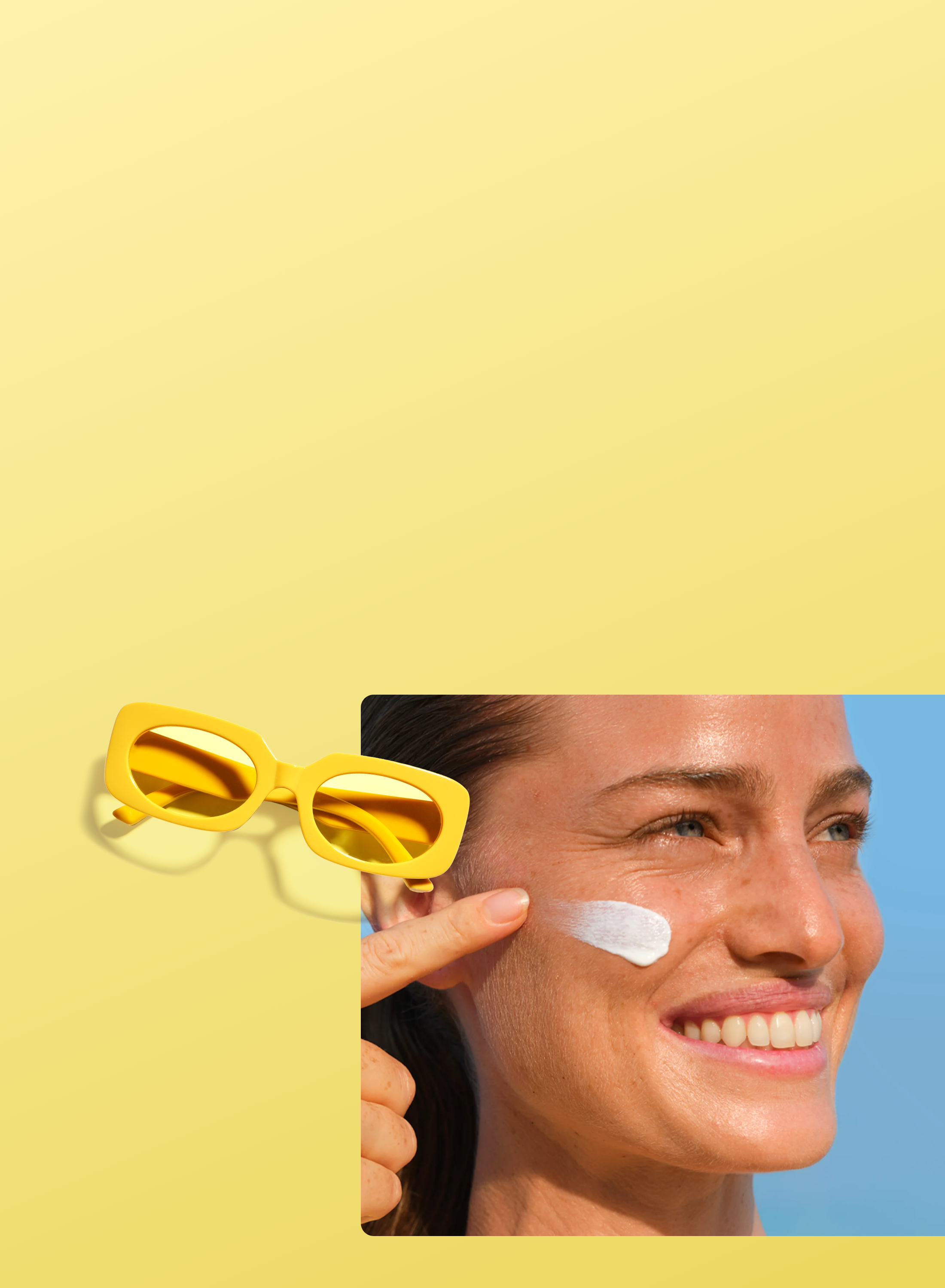A smiling woman applies sunscreen to her cheek, with yellow sunglasses placed nearby on a yellow background.