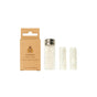 A SuperBee Dentos Eco Dental Floss box sits next to a small glass jar with a metal lid containing plastic-free vegan dental floss, along with two spare white floss rolls standing upright.