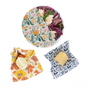 SuperBee Essentials Beeswax Wraps, a set of 3 reusable wax wraps, cover a bowl of salad, a lemon half, and cheese for plastic-free food storage on a white background.