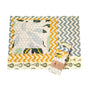 SuperBee Essentials Beeswax Wraps, 5 Wax Wraps in assorted sizes and patterns—hexagons, yellow chevrons, blue zigzags, and botanicals—shown flat with one folded in packaging for plastic-free food storage.