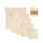 SuperBee Mesh Produce Bags: five beige cotton drawstring bags in graduated sizes and one rolled, labeled bag on a white background. Perfect eco-friendly solution for carrying fresh produce.