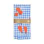 The Tomato Print Organic Cotton Kitchen Towel by Supra Endura, perfect for tomato lovers, features a blue and white checkered design adorned with vibrant red tomatoes. Wrapped in a brown paper band displaying the brands logo and product info, its both stylish and eco-friendly.