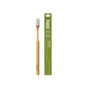 A Huppy Bamboo Toothbrush with white castor oil bristles stands beside its green box labeled "Bamboo Toothbrush," featuring a simple line illustration of this eco-friendly product.