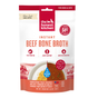 A red and white package of The Honest Kitchen Instant Beef Dog Bone Broth with Turmeric for dogs and cats, offering high protein, joint support, hydration, a “Just Add Warm Water” prep, and shown as a dog food topper beside a bowl of broth.