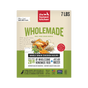 A 7 lb box of The Honest Kitchen Wholemade™ Whole Grain Chicken Dog Food features a yellow and white design with a chicken, vegetables, grains, and text highlighting its human grade quality and use of cage free chicken.