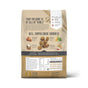 A beige bag of The Honest Kitchen Dry Dog Food, Whole Grain Beef & Oat Whole Food Clusters features ranch-raised beef images, grains, vegetables, nutrition facts, product benefits, and icons for human-grade whole food clusters.