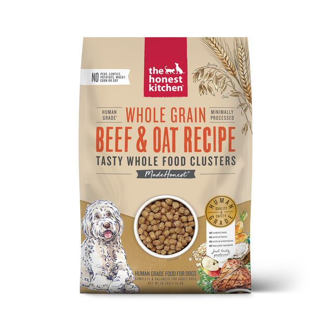 A bag of The Honest Kitchen Dry Dog Food, Whole Grain Beef & Oat Whole Food Clusters, showing a dog, oats, veggies, and whole food clusters on a beige background with red and black text.