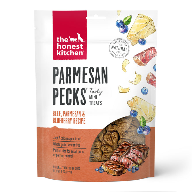 A bag of The Honest Kitchen Dog Treat Parmesan Pecks, Beef & Blueberry—healthy, natural dog treats with ranch-raised beef, parmesan, and blueberry. Packaging shows images of meat, cheese, and blueberries.