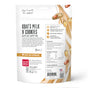 A white package of The Honest Kitchen Dog Treat Peanut Butter & Honey Goats Milk N Cookies shows ingredients, benefits, a cartoon dog, and cookie and peanut images—tasty probiotic treats with goat’s milk for your dog’s health.