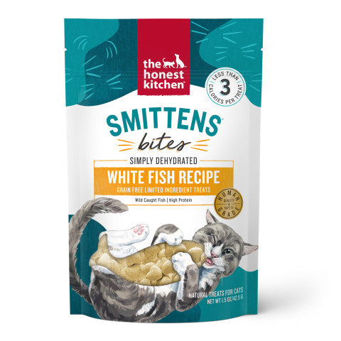 A bag of The Honest Kitchen Smittens White Fish Cat Treats, made with wild-caught fish. The playful, illustrated packaging highlights these grain-free, high-protein treats for cats.