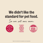 A beige graphic says, “We didn’t like the pet food standard. So we set our own.” Shown: icons for Human Grade, Certified B Corporation, and Made in the USA. Small text notes complete nutrition using wild caught salmon & cod in gravy from The Honest Kitchen.