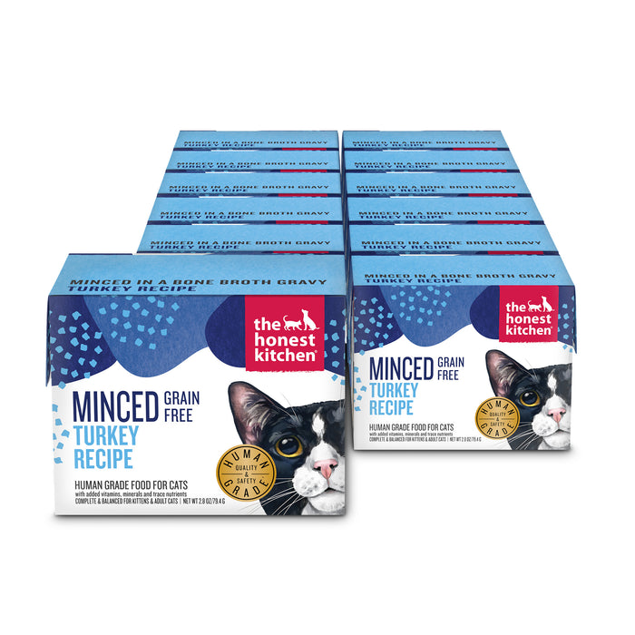 A set of twelve blue and white boxes of The Honest Kitchen Minced Wet Cat Food Turkey in Bone Broth Gravy, made with cage free turkey and featuring a black and white cat illustration on the front.