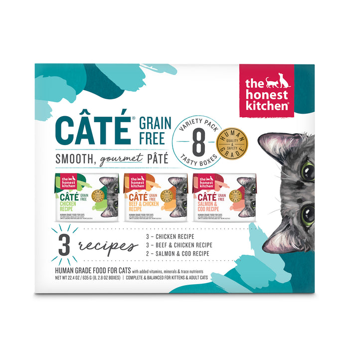 A box of The Honest Kitchen Câté Wet Cat Food - Grain Free Pâté Variety Pack, featuring 8 pouches with chicken, beef & chicken, and salmon & cod recipes. A cat’s face is shown on the right side of the box.