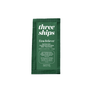 A green sachet sample of Three Ships Firm Believer™ Goji Stem Cell + Pomegranate Smoothing Neck + Face Cream (0.05 oz/1.5 g), a hydrating formula for firmer, smoother, and brighter skin.