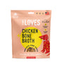 A 5 oz package of Farmland Traditions Tiny Loves - Chicken with Bone Broth Treats, in an orange bag with a playful dog illustration, offers grain-free, corn-free, soy-free, high-fiber treats made from real bone broth.