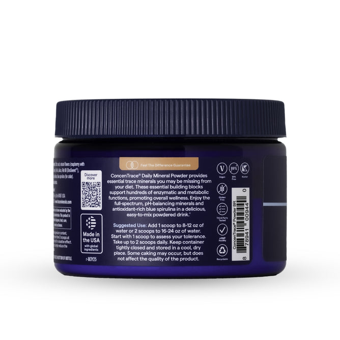 A dark blue plastic container with a black lid displays the Trace Minerals ConcenTrace Daily Mineral Powder label, featuring usage instructions, product details, icons, and a barcode. This supplement is rich in trace minerals.