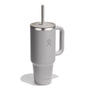 The 40 oz Hydro Flask Travel Tumbler is tall, light gray, and comes with a handle, lid with straw, and a minimalist design featuring a stylized hand logo. Its double-wall vacuum insulation is perfect for keeping your beverages at the desired temperature on the go.