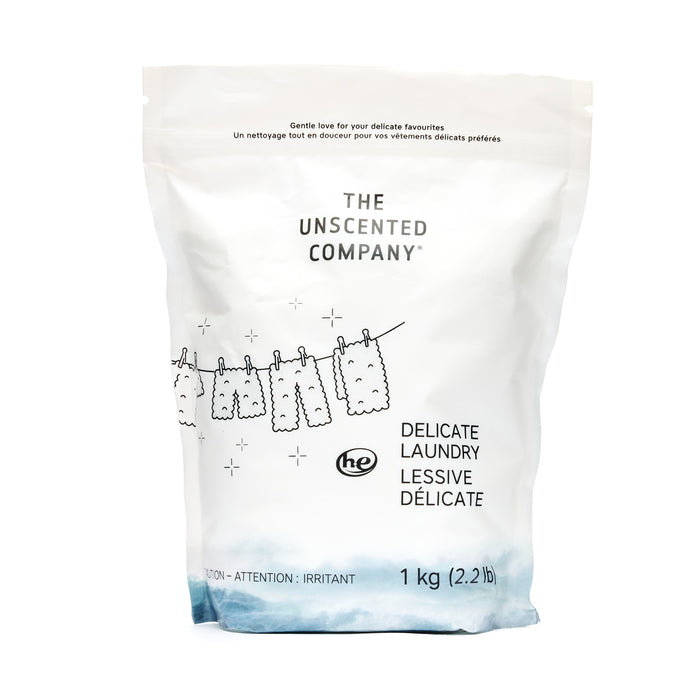 A white 1 kg bag of The Unscented Company Delicate Laundry Detergent Powder featuring minimalist line art and fragrance-free formula—ideal for delicate fabrics and sustainable laundry routines.
