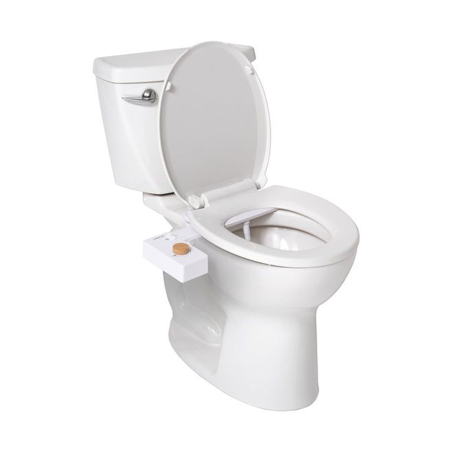 A white toilet with the lid and seat up features the TUSHY Classic 3.0 Bidet Attachment, which includes water pressure control, a self-cleaning nozzle, and a control knob on the left side beneath the seat.