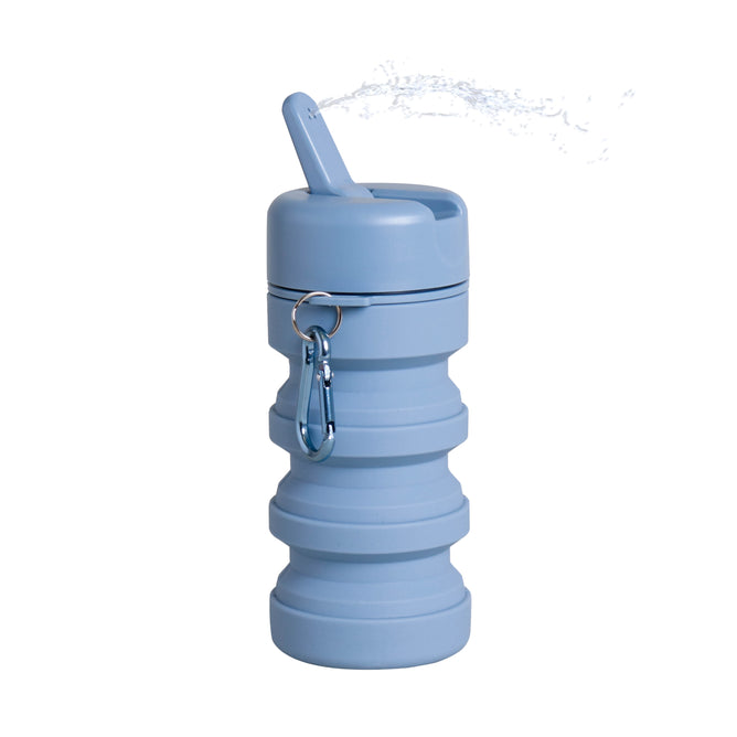 The TUSHY Travel Portable Bidet features a collapsible blue bottle with a carabiner and spout—ideal for on-the-go hygiene or TUSHY Travel adventures.