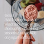 A hand holds Ora Organic Probiotic & Prebiotic Powder Supplement above a bowl of fruit. Text: Add 1 scoop to 4oz water, shake or mix, or add to smoothies, yogurt, or oatmeal for immune support.